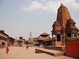 Kathmandu Bhaktapur 01 Bhaktapur Durbar Square From West With Shiva Kedarnath Temple Bhaktapur (1401m) is a traffic-free city 13 km east of Kathmandu, with cobblestone streets linking a string of temples, courtyards and squares. Bhaktapur Durbar Square is one of the world heritage sites in Nepal, reflecting the city's rich culture, art and architectural design. The 1934 earthquake destroyed many of Bhaktapur�s Durbar Square temples. Here is a view of Bhaktapur Durbar Square from the west, with the Golden Gate and Palace of 55 Windows on the left, the Vatsala Durga Temple in the centre, and Shiva Kedarnath Temple on the right.